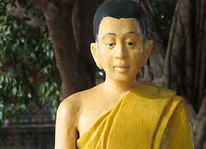 A statue gurading or accompanying the stupas