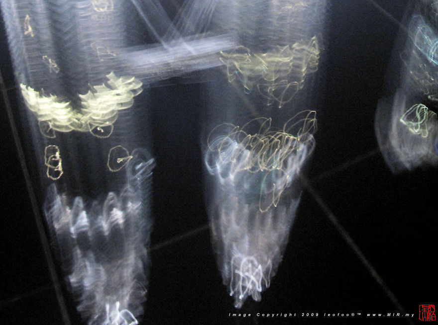 blurry shot of the rarely seen migrating birds circulating the Petronas Twin Towers (200k Jpeg) Loading...