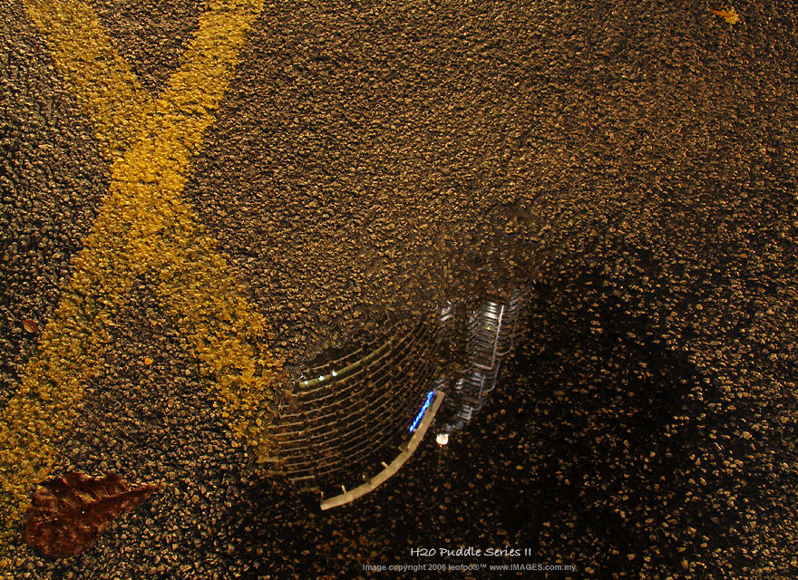 Road sign and Petronas Twin Towers, KLCC aftwer the rain, 2006