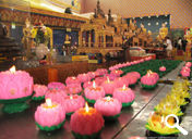 Wax candles at the front of the Reclining Buddha image at Wat Chaiyamangalaram, Penang