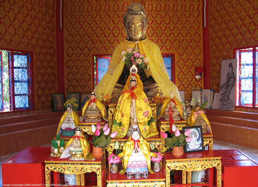 An exhibit of beautifully crafted Kuan Yin images at the side hall of the  reclining Buddha at Wat Chai Thai Buddhist Temple in Penang Island