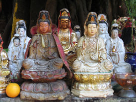 Kwan Yin images behind the temple