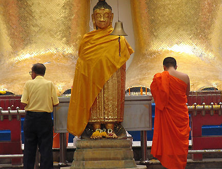 Monks and devottees performing their wish and prayers to Lord Buddha