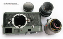Photo Profile on  Leica MP LHSA 1968~2003 Special Edition rangefinder camera model with two lenses and an original metal lens cap