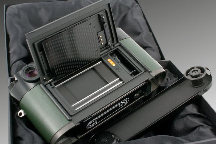 With the film back remove and shows its interior of a Leica MP  la carte Nappa Racing Green 0.58x rangefinder camera model