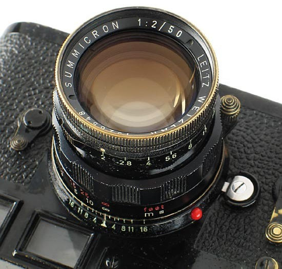 Close up view of a Leica  black paint Summicron-M 50mm f/2.0 lens 