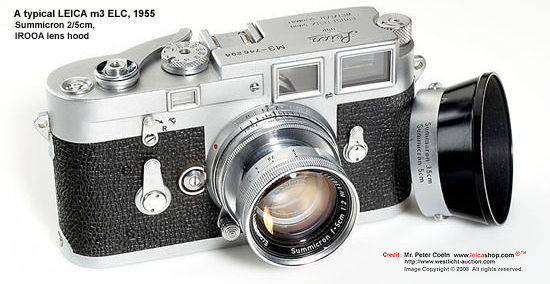 An early Leica M3 ELC camera model, 1955 with matching collapsible 5cm 1: 2 Summicron standard lens w/ IROOA lens hood