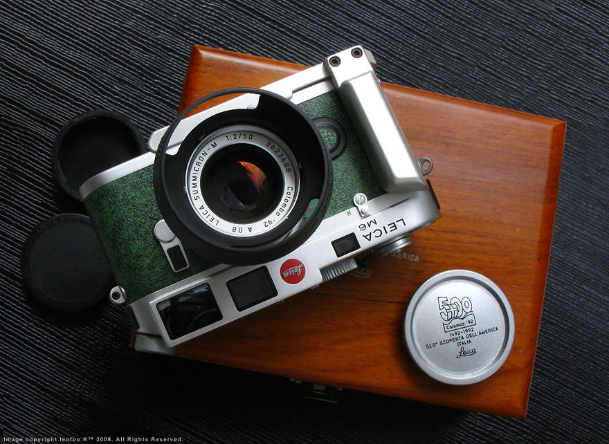 Leica M6 Chrome Colombo '92 Special 500th Anniversary Italian Edition collectible rangefinder camera with Summicron-M 1:2/50mm Colombo Edition, engraved metal body cap, lens hood, Walnut display wooden box and a third party made anodized chrome Hand grip