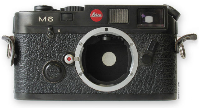 A typical LEICA M6 anodized black finish rangefinder camera body without a LEICA M-lens attached, it shows interior features inside the lens mount as well as overall front view of this classic LEICA rangefinder camera