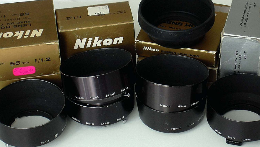 Various versions of lens hoods designed for Nikkor 50mm standard lenses