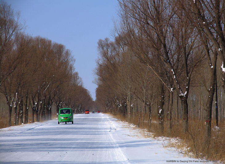 A country road with popular tri-wheeler car from Daqing Oil Field to Inner Mongolia