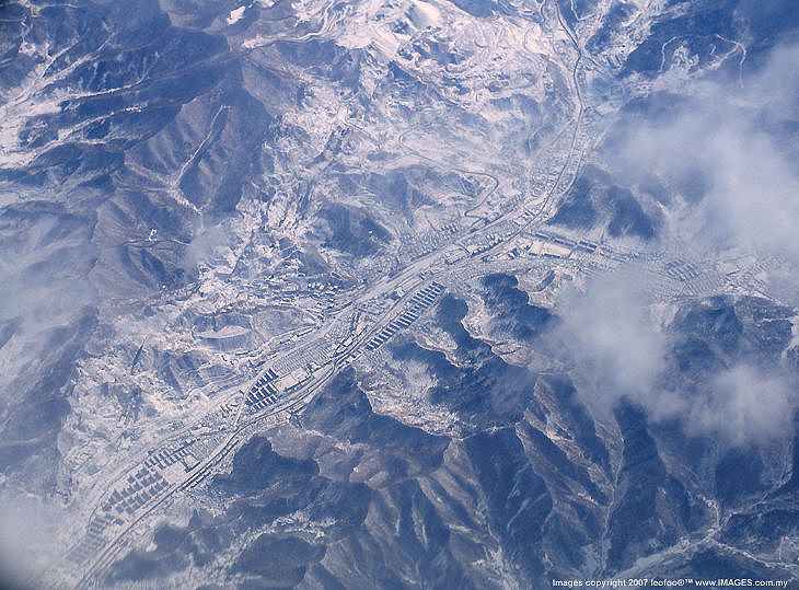 Shooting through the plane window. Zhang Bai Shan mountain range, north east of China