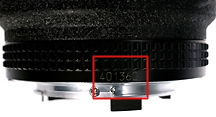 Location of the Serial Numbering of  the AF Nikkor lens