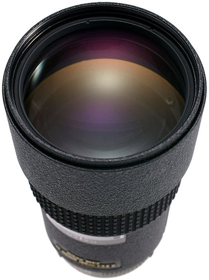 Beautifully captured front section of the lens element of the AF Nikkor 180mm f/2.8D IFED