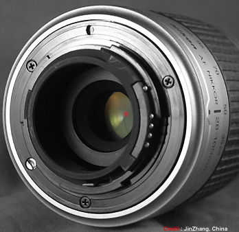Hybrid metal and harden plastic rear lens mount on Nikon AF zoom lens on silver colored version