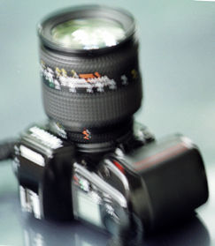 Nikon F90x with an AF Zoom Nikkor 20-200mm telephoto zoom lens attached.