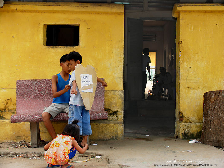 Angel, street kids at play in Phnom Pehn Cambodia 