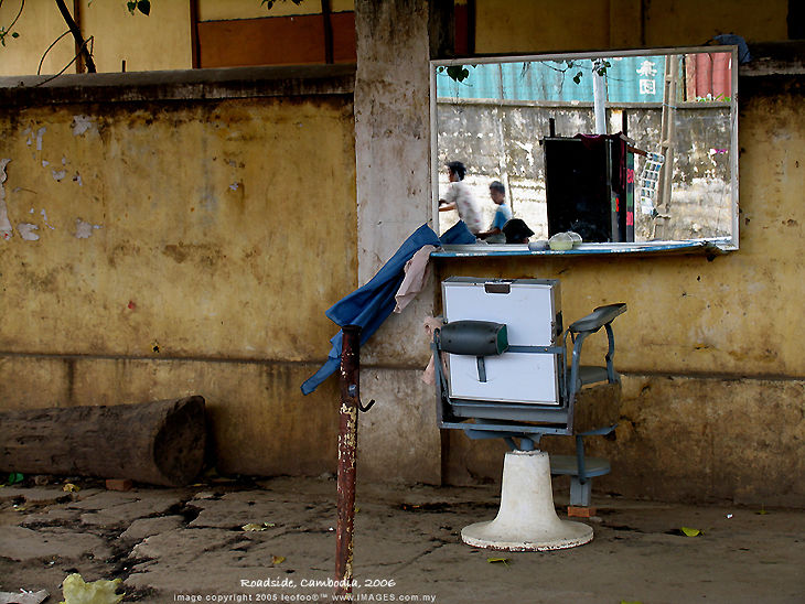 A road side barber stand in Phnon Penh, Cambodia
