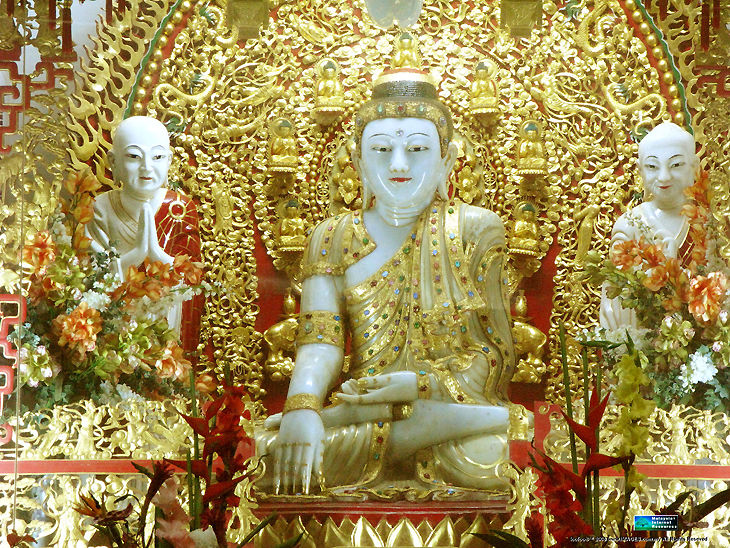 An aged old 100 years old Buddha Statue with full gem stones and gold decoration that located at IPOH Cave temple 