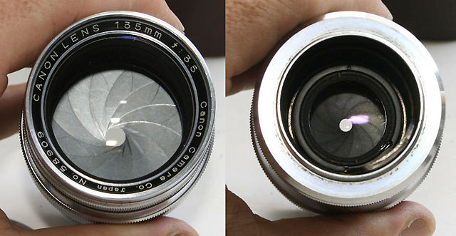 Front and back view of an all chrome Canon 135mm f/3.5 telephoto lens