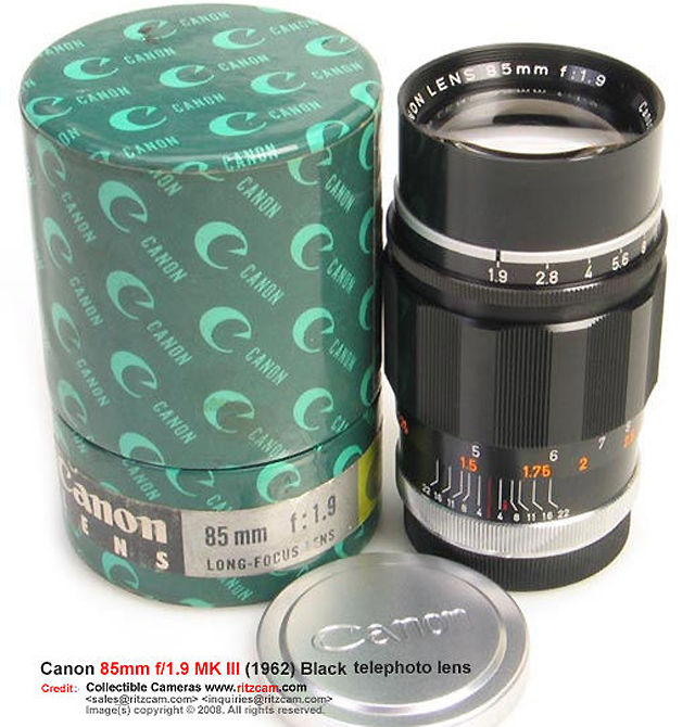 Black body Canon 85mm f/1.9 telephoto lens with green canon packaging box