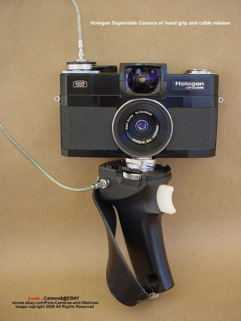 The Hologon ultrawide camera front section view with a companion accessory, hand grip and cable release
