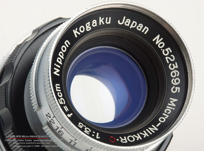 beautiful view of lens coating on a  Leica M39 threaded /screw mount version of Nippon Kogagu Japan /  rangefinder series of Micro-Nikkor 1:3.5 f=5cm /50mm f/3.5
