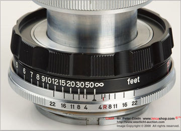 Black Focusing ring and depth of field scales on a LEICA M39 micro-Nikkor 5cm 