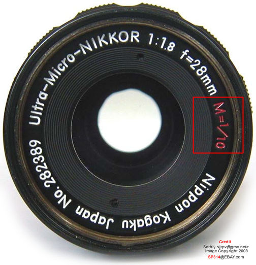 The incription of magnification 1/10 on a Ultra-Micro-NIKKOR 28mm f/1.8e