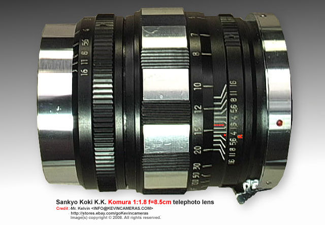 A lovely and detailed view on various lens deatils, features on the lens barrel of a Sankyo Koki K..K. Komura 1:1.8 f=8.5cm (85mm f/1.8) Telephoto lens