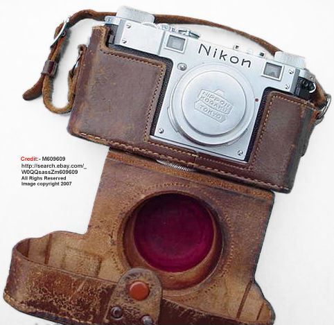 Nikon M with original leather case and a chrome body cap on