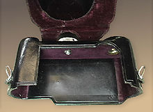 A rare black leather camera case for Nikon SP rangefinder cameras inside the compartment