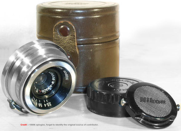 An original leather case with  a chrome body cap on a 135mm Nikkor lens
