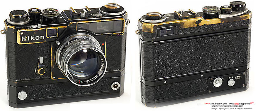 A well used, NIKON SP in black with NikonS36 electric motor drive