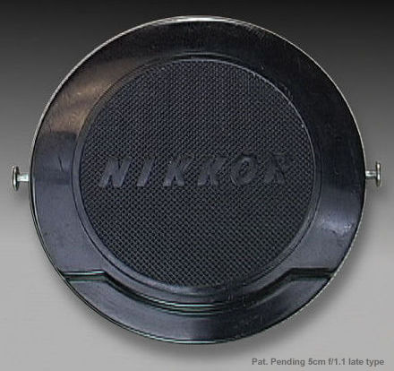Front section view of a 62mm filter thread Pat. Pending inscription of a Nippon Kogaku JAPAN post occupation period lens cap in newer design designed for Nikkor-S.C 1:1.1 f=5cm