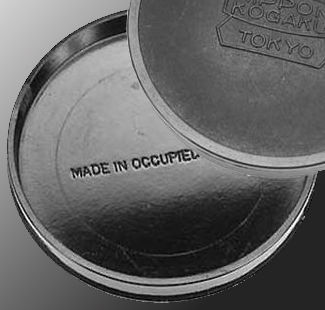 Typical old, vintage MIOJ period lens front / rear lens caps with Nippon Kogaku Tokyo at the front and Made in Occupised Japan at the innder section of the lens cap