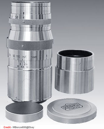 A typical acccessories for an old chrome Nikkor-Q 13.5mm f/4.0 with front and rear caps, lens hood. 