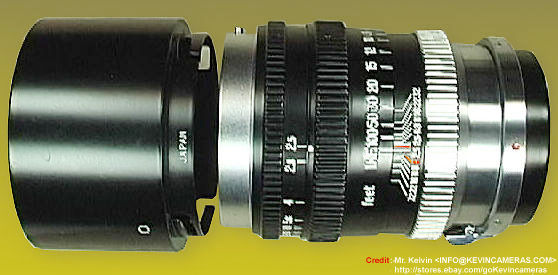 A side view of the  rangefinder version Nikkor-P.C 105mm f/2.5 with the rare, early version of the  bayonet snap on metal lens hood 