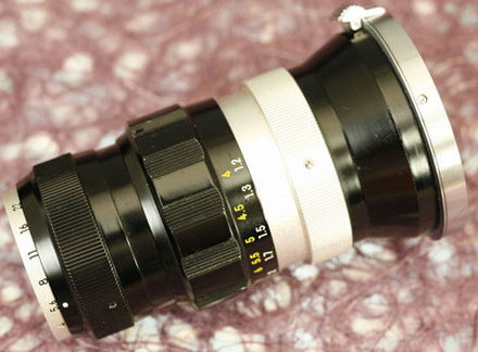 Various lens features on a rangefinder (RF) version of the Nikkor-T 1:4 f=10.5cm (Nikkor-T 105mm f/4.0) telephoto lens for Nikon rangefinder system VIEW B
