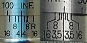 comparing depth of field scales between an 135/4 and 135/f.3 Nikkor rangefinder telephoto lens