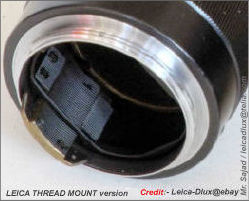 high res view of an all black, black paint  version of a Nikon RF Nikkor-Q.C 1:3.5 f=13.5cm telephoto lens for rangefinder Nikon cameras