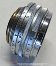Canon  RF 28mm f/2.8 side view all chrome version