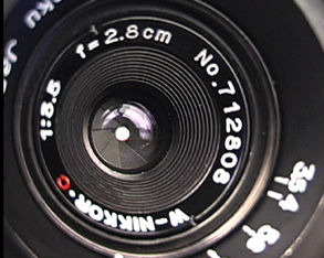The recessed front exposed lens element of W-Nikkor 2.8cm f/3.5 RF wideangle lens