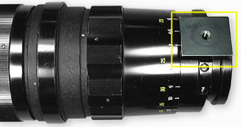 The black painted coated tripod collar on the rangefinder Nikkor 350mm f/4.5 telephoto lens