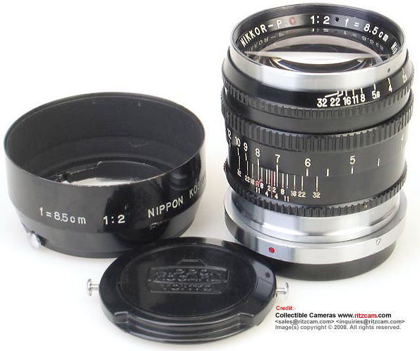 Black lens barrel version (late 2nd model/ series) of  a Nippon Kogaku (Nikon) Nikkor-P 1:2 f=8.5cm telephoto lens for Nikon rangefinder cameras (with newer plastic lens cap and black metal snap-on lens hood)