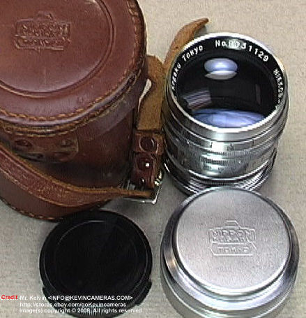 Standard accessories of leather case,  chrome lens cap for an older version of  Nikkor-P 1:2 f=8.5cm telephoto lens for Nikon rangefinder cameras