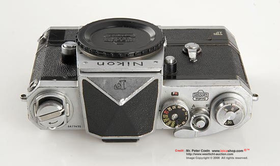 Nikon F Eye level Chrome w/F36 Motor Drive
 With a heavy used early camera with matching and very early Tokyo F-36 motor drive no.976xx, early body cap. Approx. Year: 1960 
