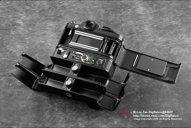 Open film back view of NIKON F2 H-MD w/MB-100+MD-100+2xMH-100+charger, TITAn