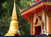 A small Pagoda at the side of the new temple structure at Wat Chaiyamangalaram (Wat Chai) Thai Buddhist Temple