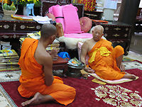 The current chief monk / abbot of Wat Pak Nam talking to visiting monks